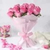 15 pink roses and seasonal leaves