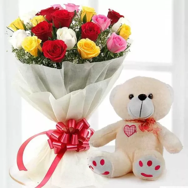 20 multi color roses and seasonal leaves and a medium size teddy bear