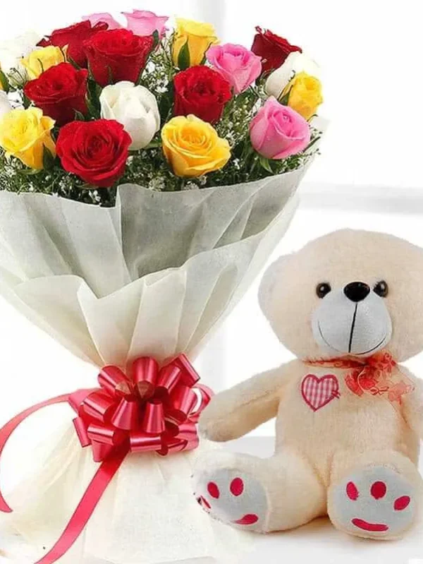 20 multi color roses and seasonal leaves and a medium size teddy bear
