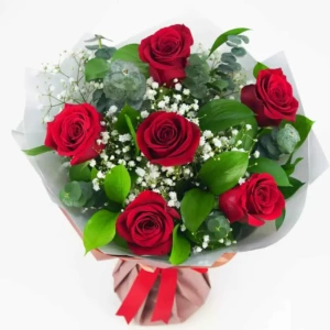 6 red roses, baby's breath and extra seasonal leaves bouquet