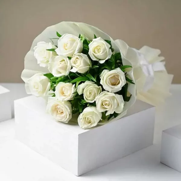 12 white roses and seasonal fillers