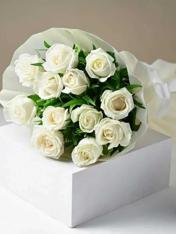12 white roses and seasonal fillers