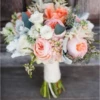 Mixed flowers bridal bouquet with extra seasonal leaves