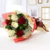 6 red and white South African roses baby's breath and extra seasonal leaves