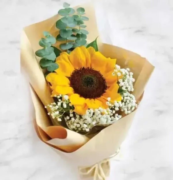 Sun Flowers, baby's breath and seasonal leaves